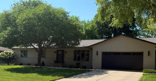 New gray asphalt shingle roof on single-story residential home with gable design